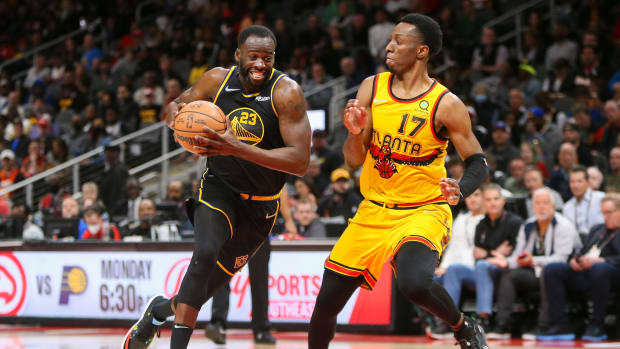 Golden State Warriors forward Draymond Green (23) drives on Atlanta Hawks forward Onyeka Okongwu.